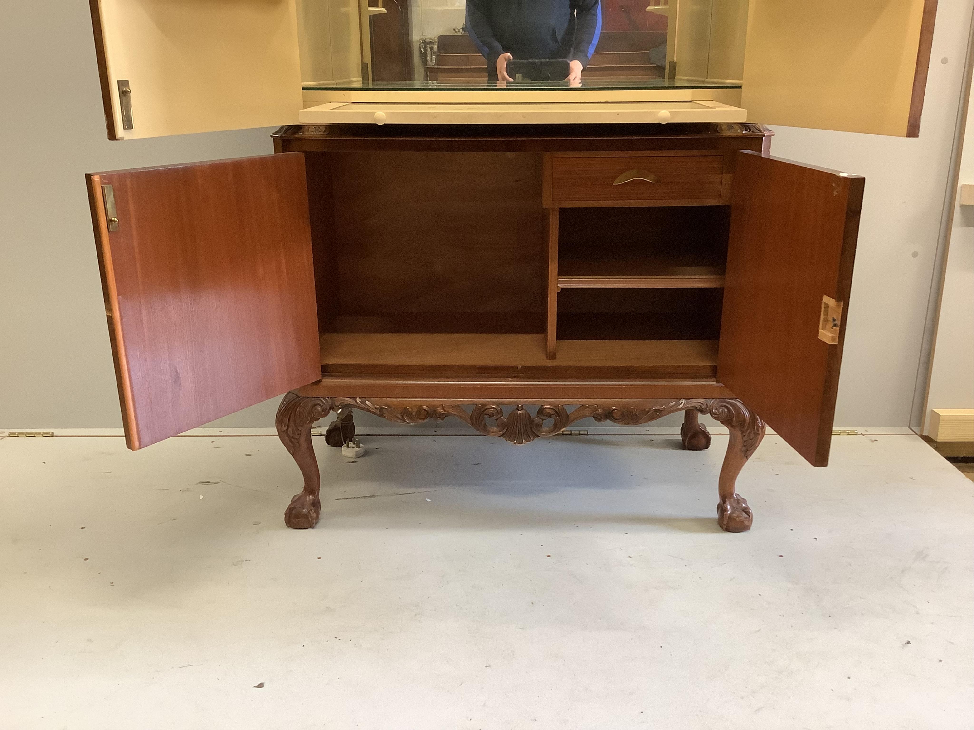 A Queen Anne Revival walnut cocktail cabinet, width 94cm, depth 48cm, height 160cm. Condition - good